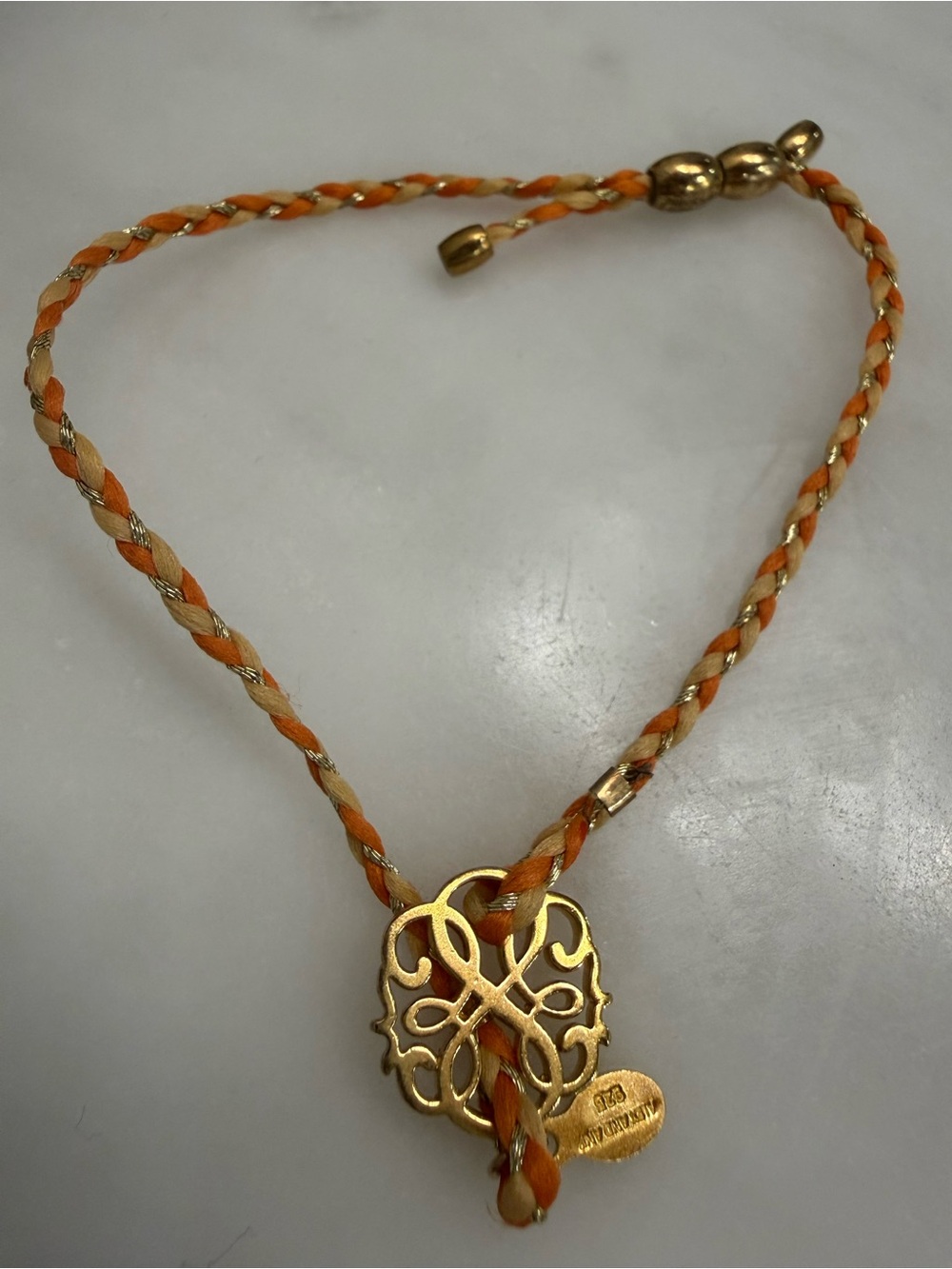 Braided Alex and Ani Orange and Cream Necklace with Gold Filigree Pendant